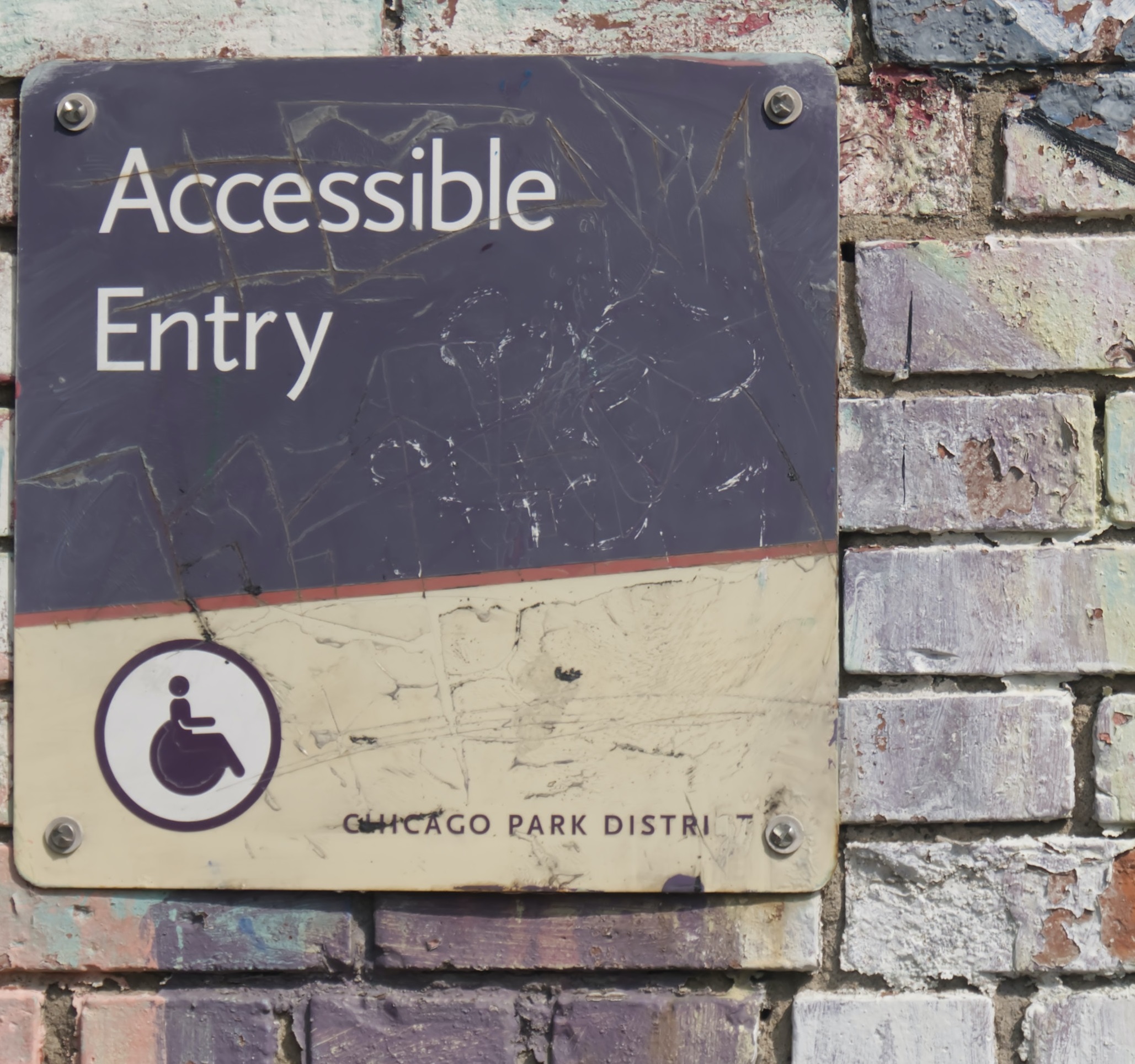 An Image of an accessible entry sign. 